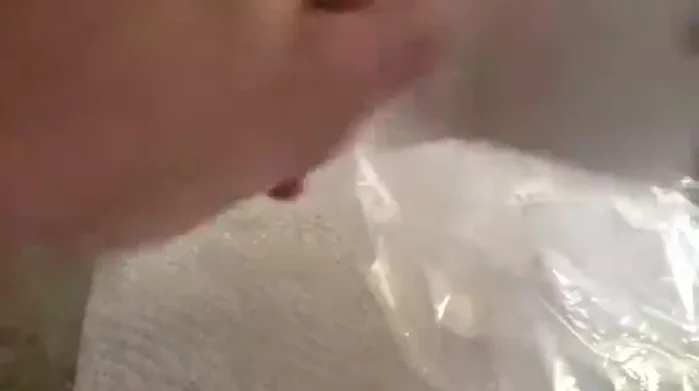 Create a lip around the opening of the bag by folding it over. This allows for better adhesion to the car door.