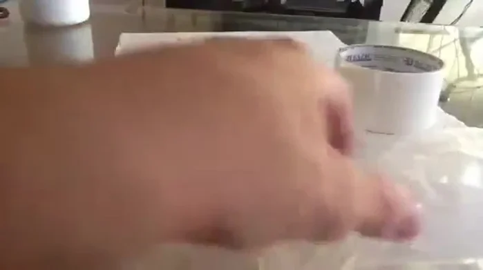 Tape the bag to the car door, ensuring the hole is positioned over the lock mechanism.