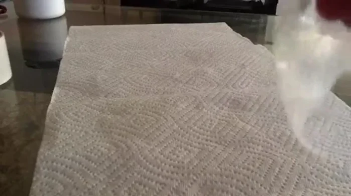 Create a lip around the opening of the bag by folding it over. This allows for better adhesion to the car door.