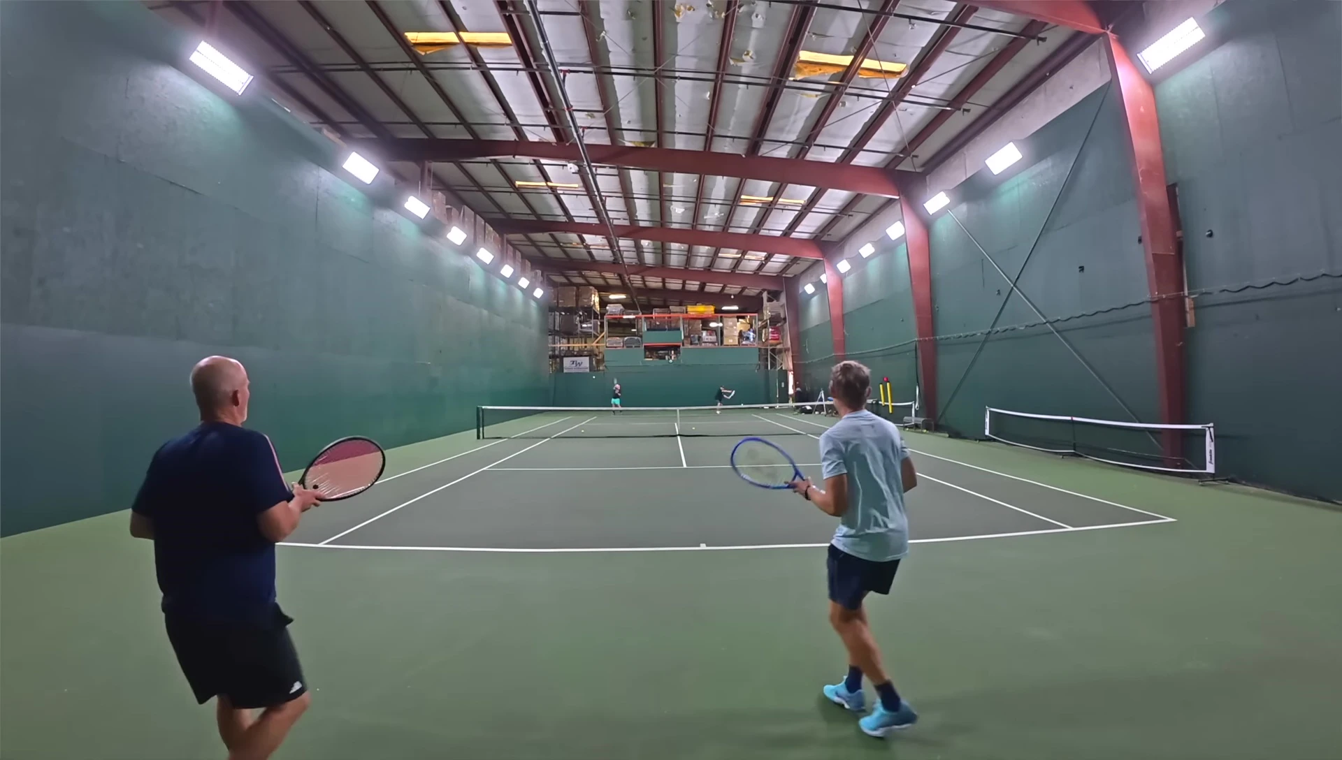 The reviewer hitting the ball with the Yonex Ezone 2025.