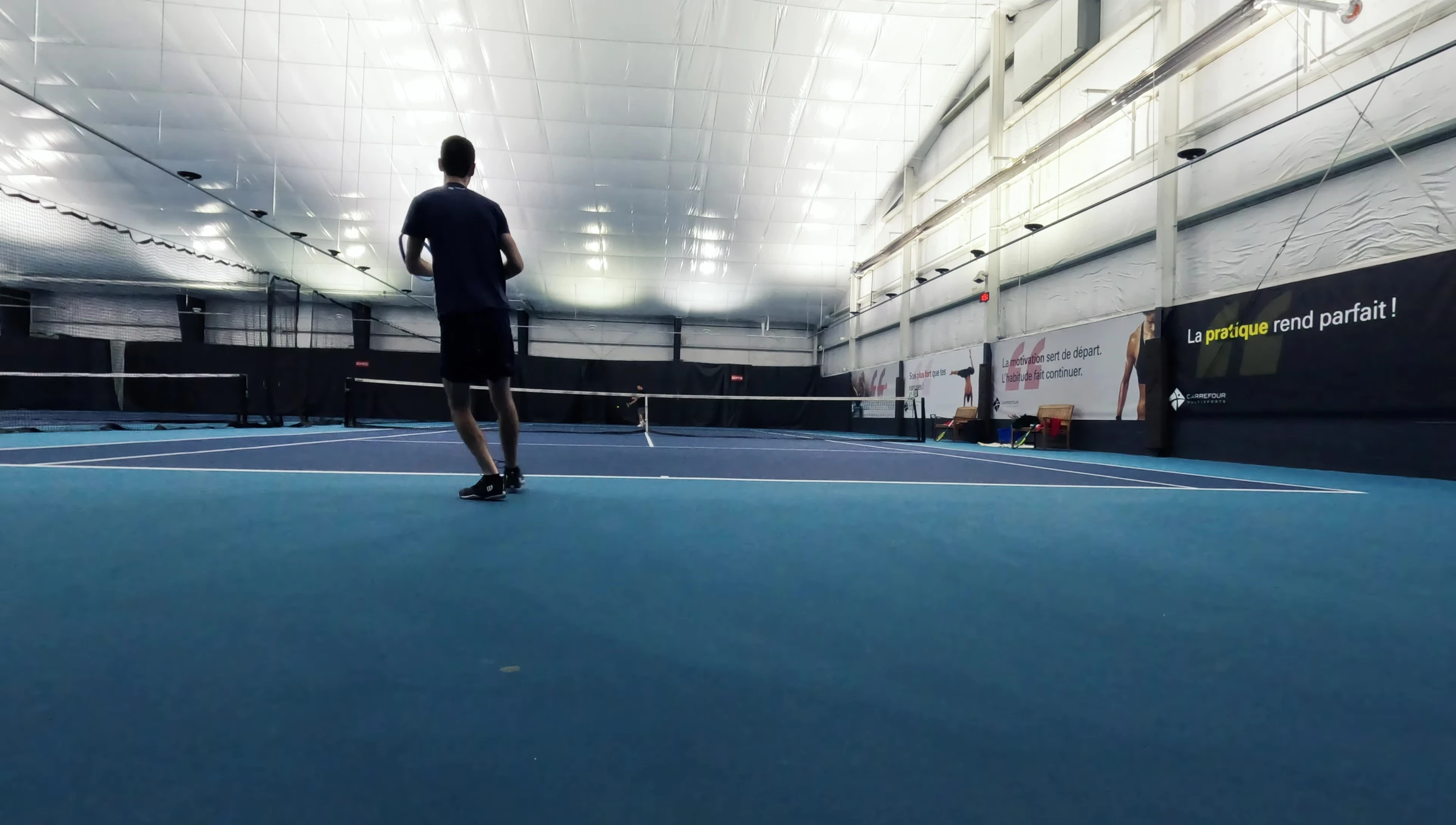 Action shot illustrating the reviewer's volley technique.