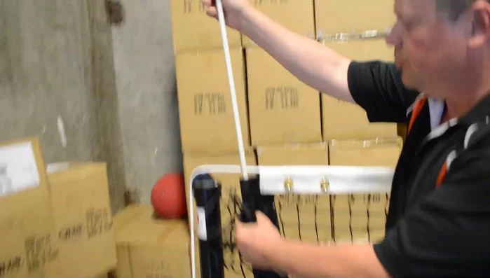 Insert the rods into the end sleeves of the net.