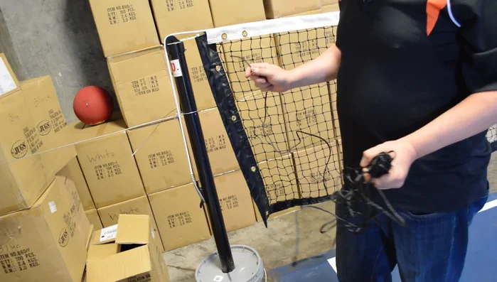 Lace the net to the posts using the grommets at the top and sides. (Refer to the diagram on the website for detailed instructions.)