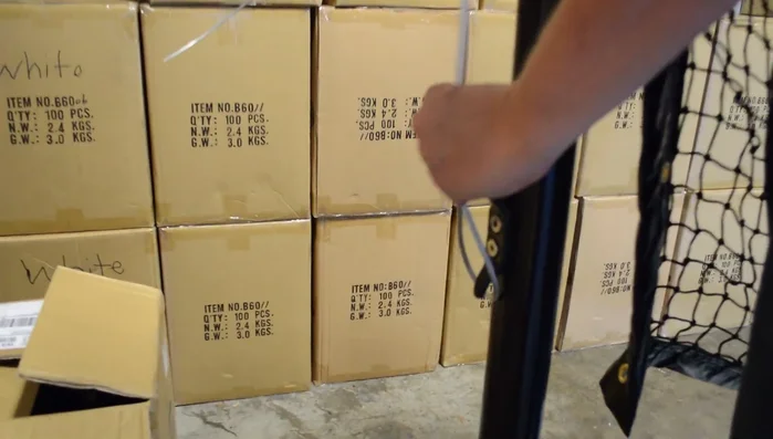 Run the cable to the other side of the net. The other loop goes around the pin on the crank.