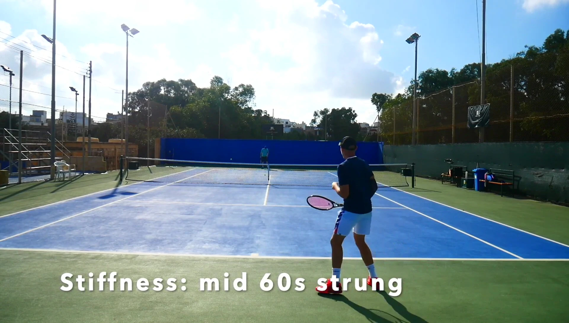 The reviewer hitting a volley