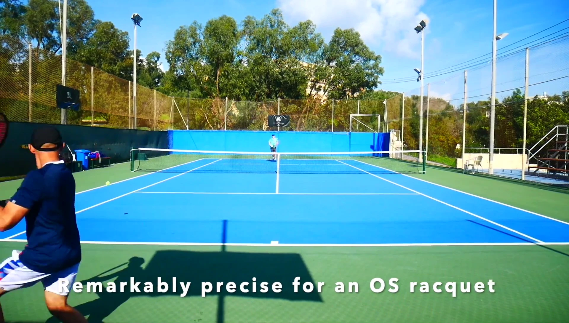 The reviewer attempting a serve
