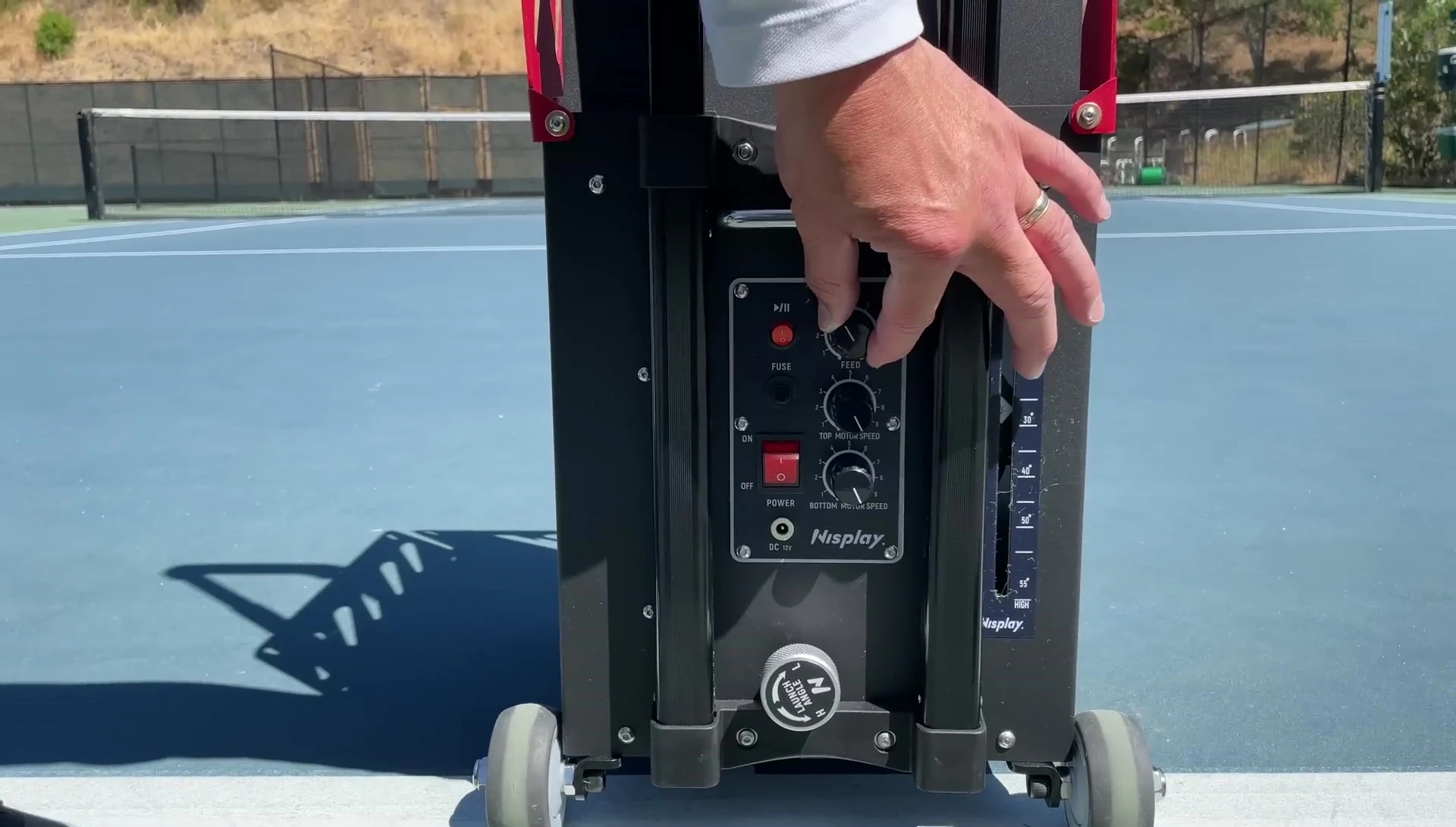 Close-up of the controller showing the different knobs for speed, spin and launch angle.