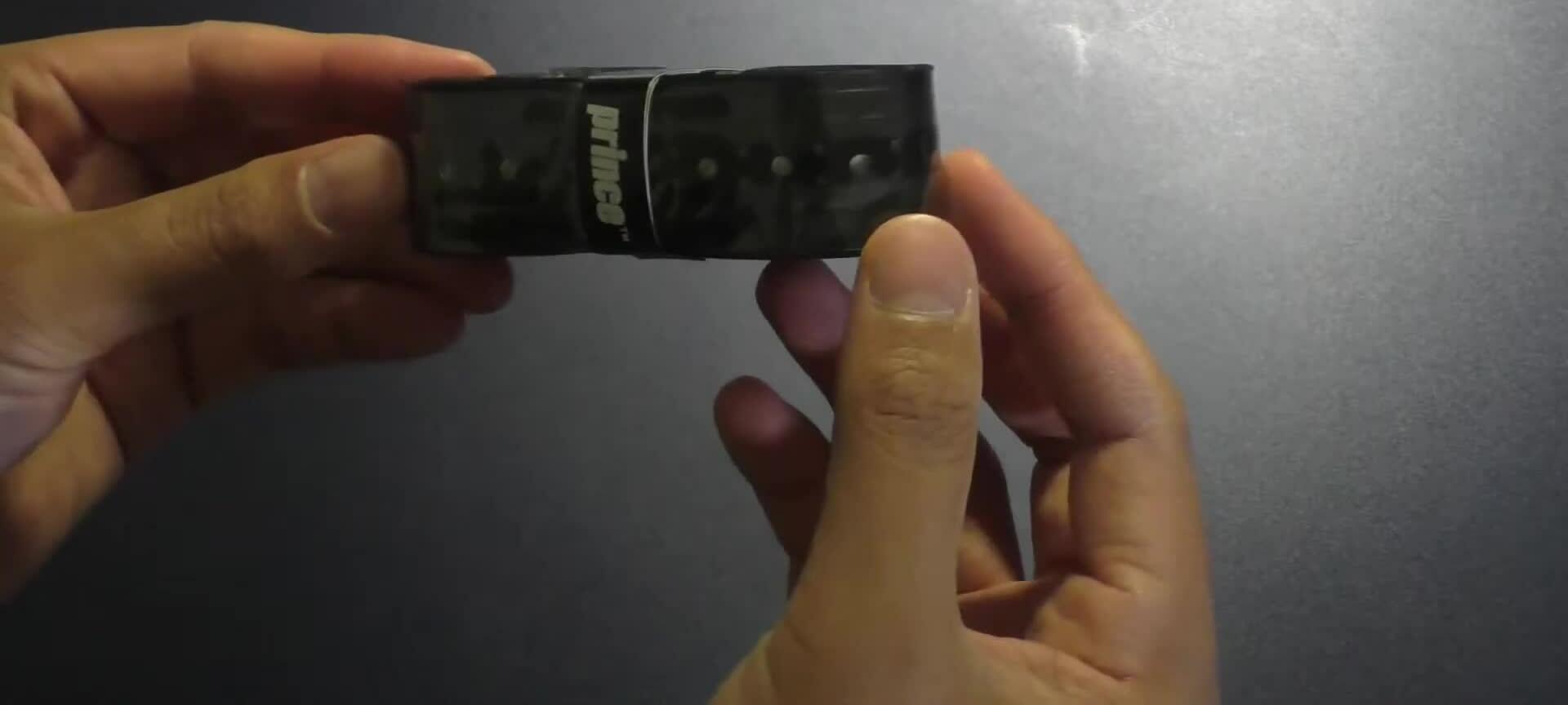 Close-up of the Prince DuraShock grip on a tennis racquet