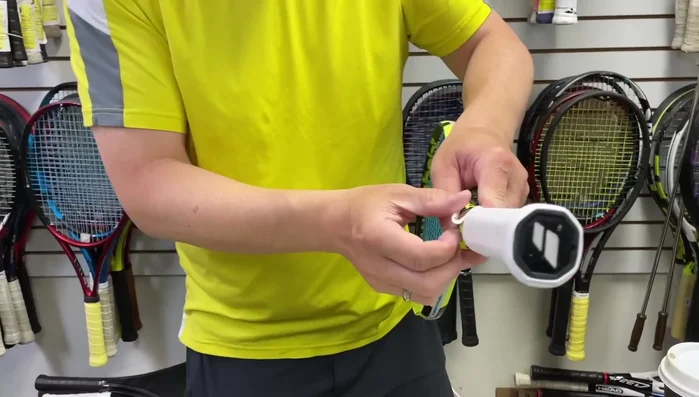 Use the finishing tape to secure the folded end, ensuring a neat and professional finish.