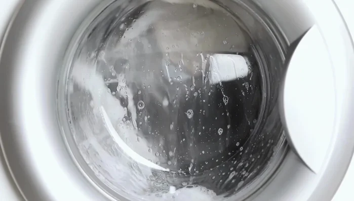 Rinse towels thoroughly to remove detergent residue. Add an extra rinse cycle if needed.