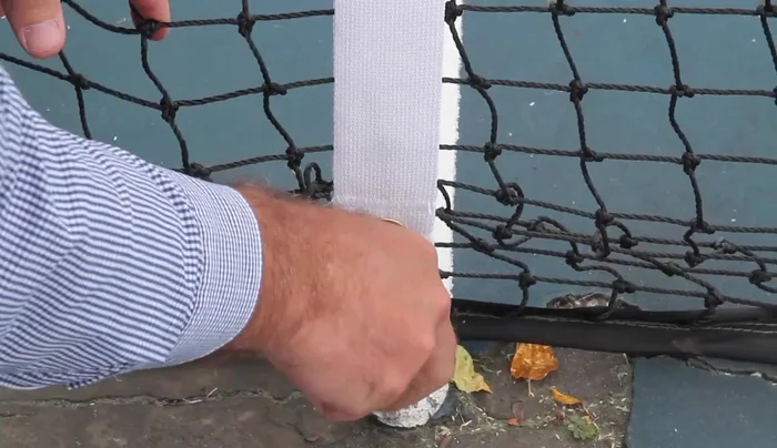 Clean the connection at the bottom of the center strap.