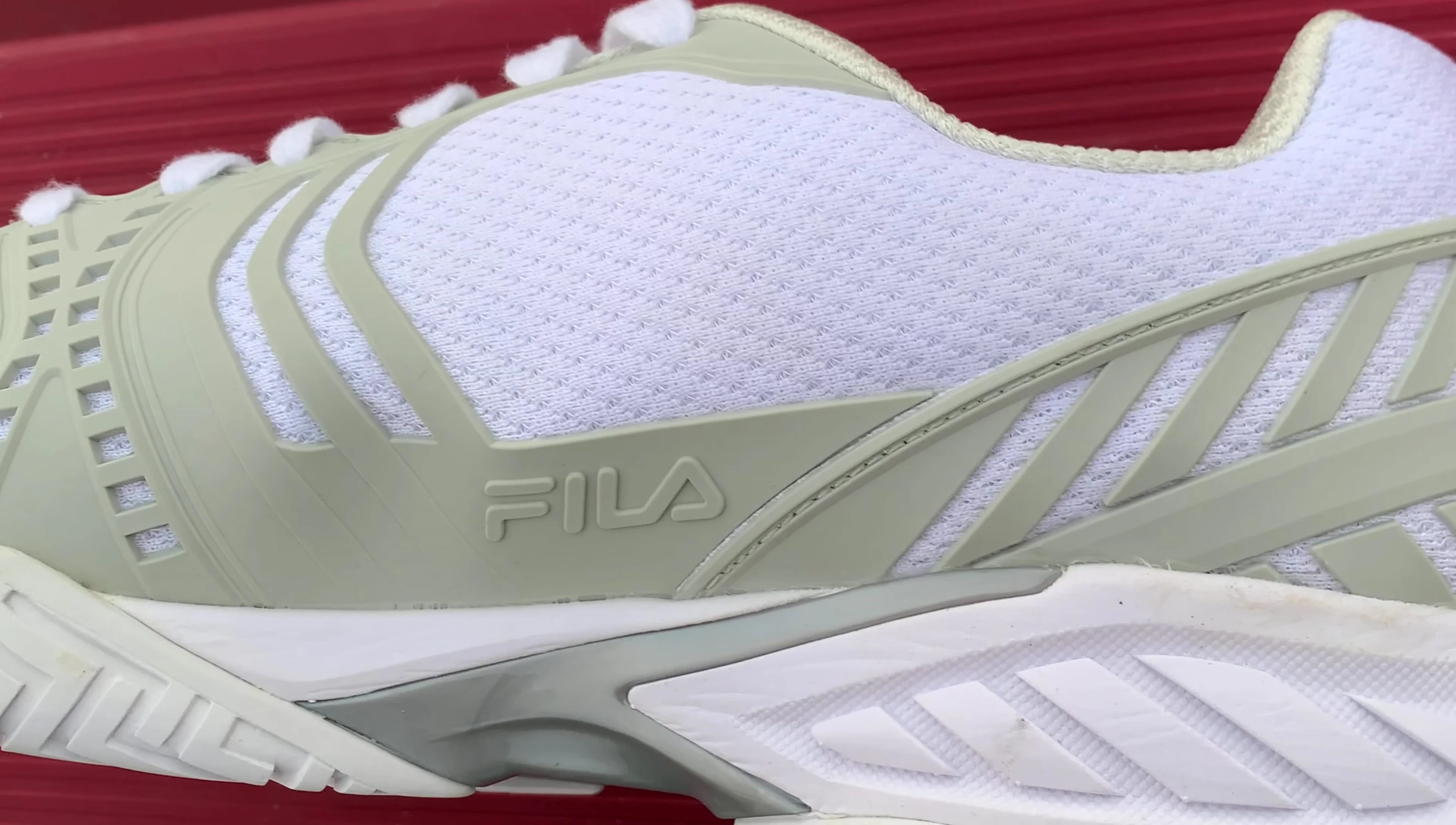 Close-up of the lightweight mesh upper material of the Fila Axilus 2 Energized tennis shoe.
