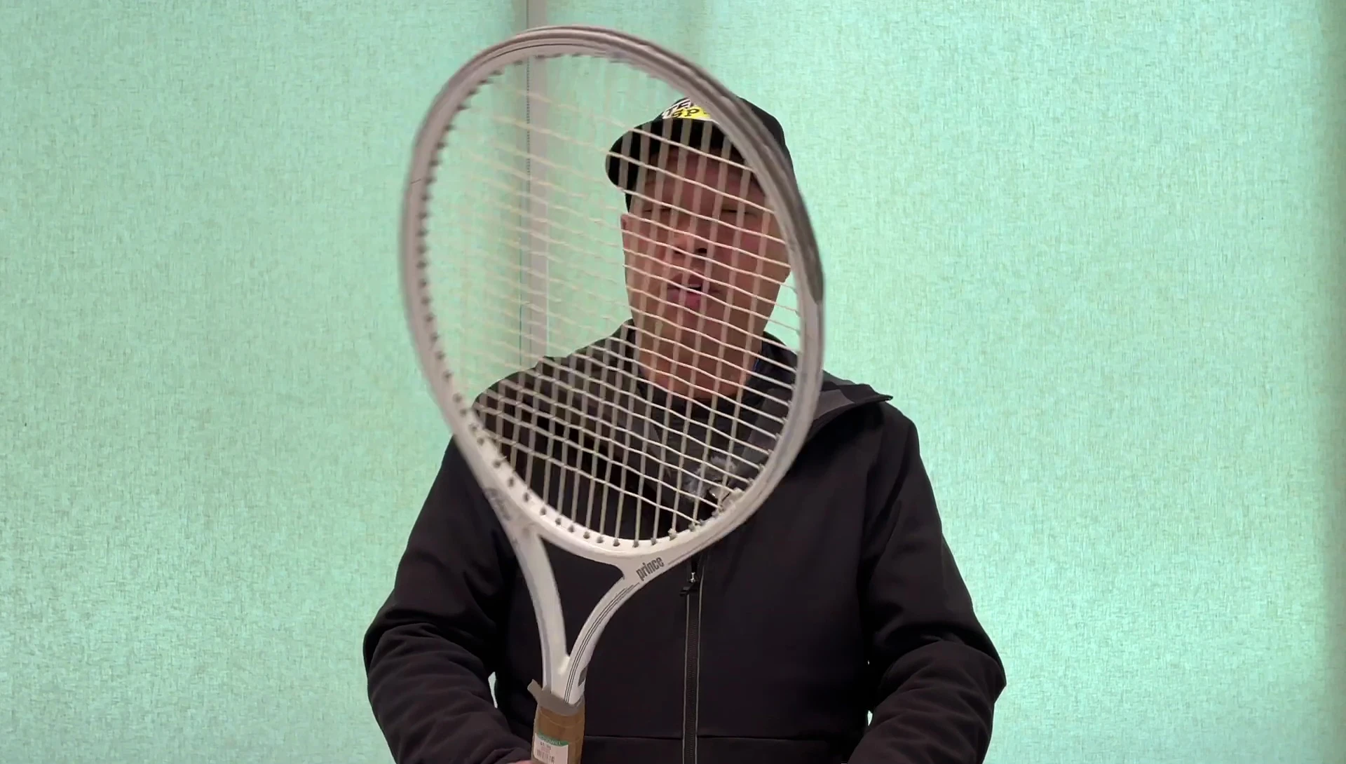 The narrator discusses his long search for the Prince Spectrum Comp 110 racket.