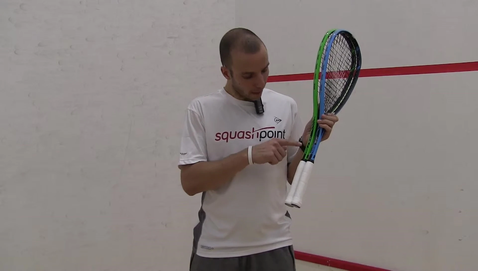 Close-up of racket specifications highlighting the power difference (750 vs 650).