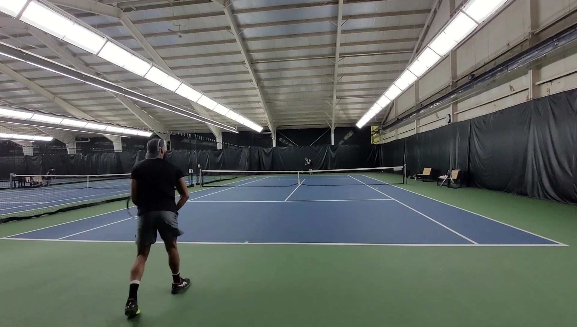 Close-up of the 18x20 string pattern of the HEAD Speed Pro racquet.