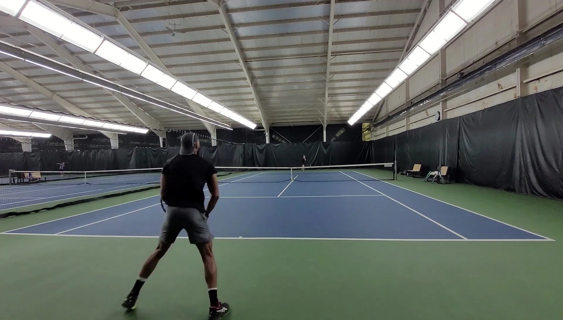 The reviewer summarizing the key features and differences between the Midplus and Pro versions of the racquet.