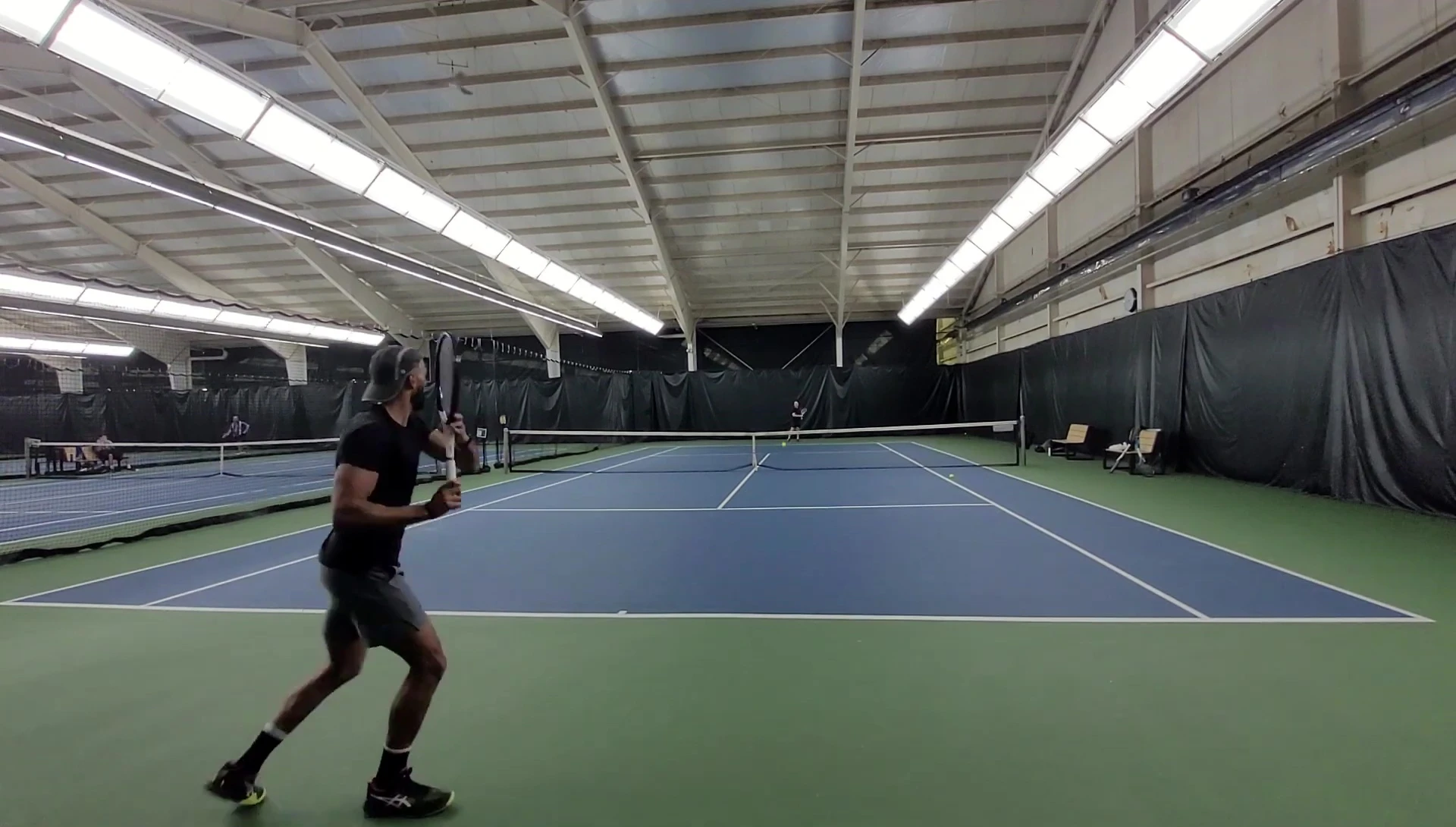 Close-up shot of the 16x19 string pattern on the HEAD Speed Midplus racquet.