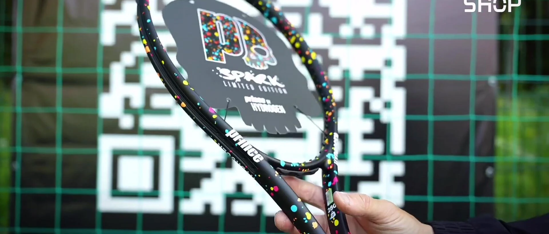 Detailed view of the racket showcasing its 'Hydrogen' color scheme.