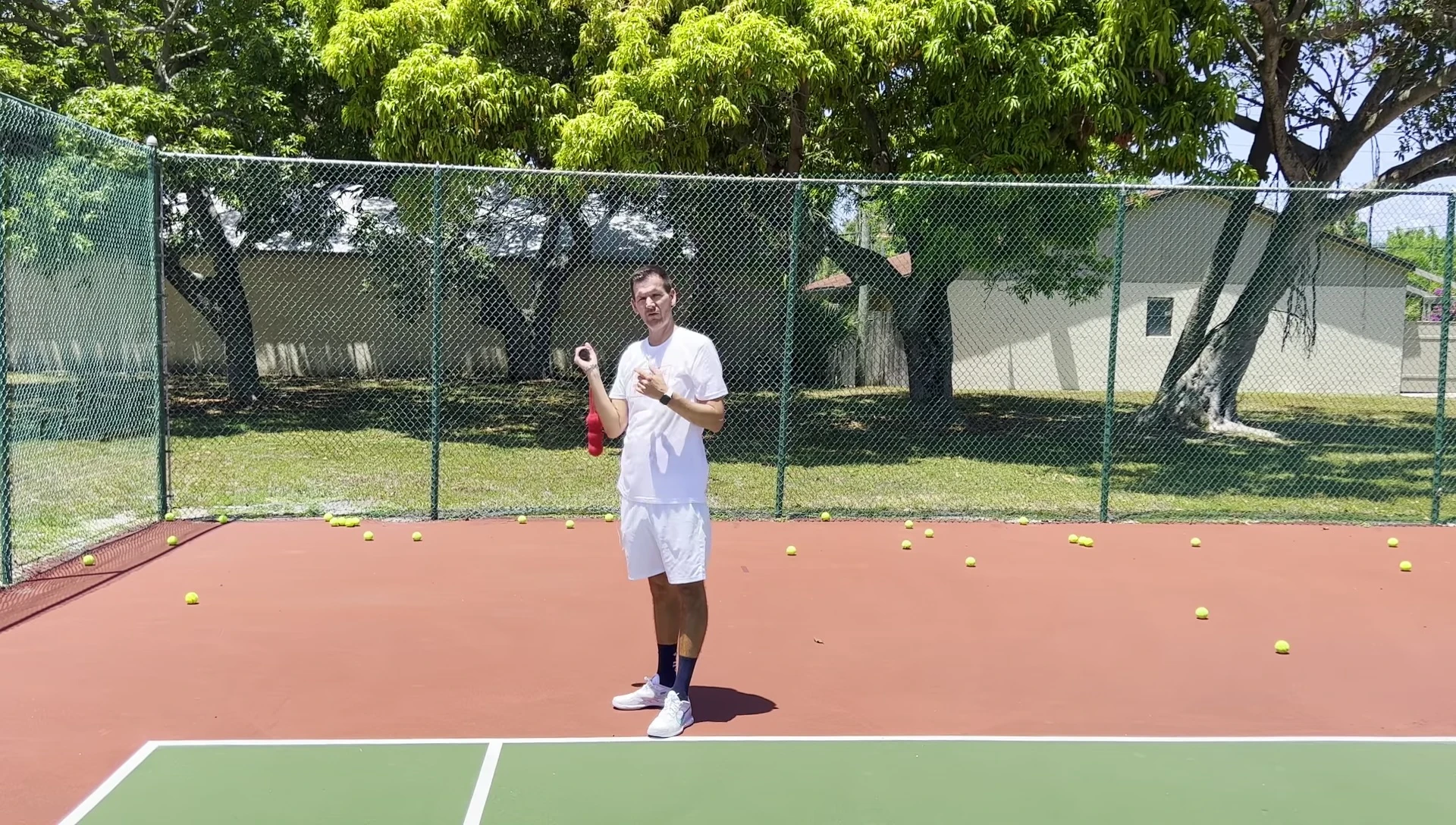 Demonstrating the looping motion with the serve trainer.