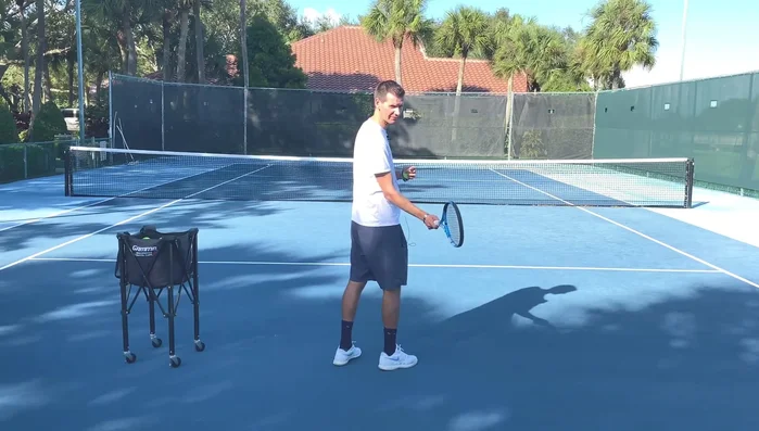 Let your wrist lag naturally behind the racket head, similar to a regular forehand.