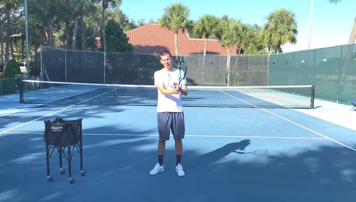 Keep your finish short; point the racket tip towards the other side after the hit.