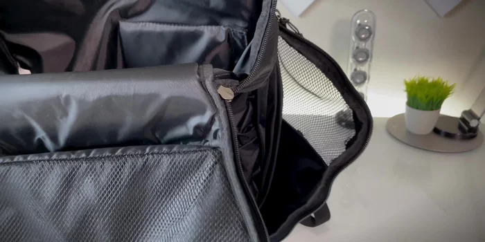 Use the side ventilated waterproof compartment for dirty gear or shoes; it can compress when not in use.